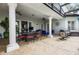Spacious outdoor patio with columns, ample seating, and a view of the pool at 11014 Hawkshead Ct, Windermere, FL 34786