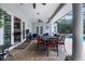 Covered outdoor patio with a dining table and chairs, offering a great space for entertaining at 11014 Hawkshead Ct, Windermere, FL 34786