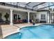 Inviting pool area with covered patio, offering a relaxing outdoor space at 11014 Hawkshead Ct, Windermere, FL 34786