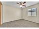 Neutral bedroom with carpet, ceiling fan and window bringing in lots of natural light at 117 Honeywood Dr, Kissimmee, FL 34743