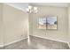 Dining area with tile floors, natural light from a large window, and hanging chandelier at 117 Honeywood Dr, Kissimmee, FL 34743