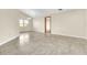 Spacious living room with tile floors, large window, and neutral paint, creating a bright and airy atmosphere at 117 Honeywood Dr, Kissimmee, FL 34743