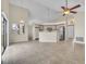 Bright living room and kitchen with tile flooring, pendant lights, and stainless steel appliances at 117 Honeywood Dr, Kissimmee, FL 34743