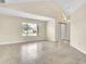 Bright living room featuring a large window and light tile flooring at 117 Honeywood Dr, Kissimmee, FL 34743