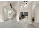 Elegant foyer with soaring ceilings, a grand staircase, and beautiful tile flooring at 12222 Cypress Landing Ave, Clermont, FL 34711
