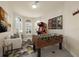 Entertaining game room with foosball, an arcade game, and comfortable seating area at 12222 Cypress Landing Ave, Clermont, FL 34711