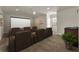 This home theater features reclining seating, a ceiling fan, and a wet bar at 12222 Cypress Landing Ave, Clermont, FL 34711