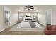 Spacious main bedroom featuring tray ceilings, carpeted floors, and ensuite bath at 12222 Cypress Landing Ave, Clermont, FL 34711