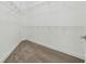 Empty walk-in closet with carpeted floors and wire shelving, offering ample storage space at 12222 Cypress Landing Ave, Clermont, FL 34711
