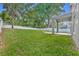 Expansive backyard featuring well-maintained lawn, fire pit and fenced perimeter at 131 Calabria Springs Cv, Sanford, FL 32771