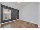 Bedroom with wood-look floors and a window at 131 Calabria Springs Cv, Sanford, FL 32771