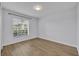 Bedroom with wood-look floors and a window at 131 Calabria Springs Cv, Sanford, FL 32771