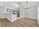 Bright kitchen features gray cabinets, stainless steel appliances and breakfast nook at 131 Calabria Springs Cv, Sanford, FL 32771