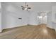 Spacious living room with wood-look floors and bright lighting at 131 Calabria Springs Cv, Sanford, FL 32771