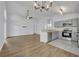 Open-concept living room and kitchen with modern appliances and flooring at 131 Calabria Springs Cv, Sanford, FL 32771