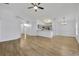 Open-concept living room and kitchen with modern appliances and flooring at 131 Calabria Springs Cv, Sanford, FL 32771