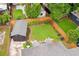 An aerial view of a backyard featuring a patio, lawn, fence, and shed at 14 N Lawsona Blvd, Orlando, FL 32801