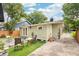Side view of home and backyard with patio and artificial turf at 14 N Lawsona Blvd, Orlando, FL 32801