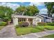 Charming home featuring a landscaped yard and inviting front porch at 14 N Lawsona Blvd, Orlando, FL 32801