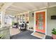 Cozy front porch with seating, natural light, and an inviting front door at 14 N Lawsona Blvd, Orlando, FL 32801