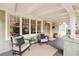 Relaxing front porch with seating area, textured walls, and well lit from natural light at 14 N Lawsona Blvd, Orlando, FL 32801