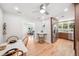 Eat-in kitchen with stainless steel appliances, wood floors, and a view of the living room at 14 N Lawsona Blvd, Orlando, FL 32801