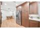 Modern kitchen with stainless steel appliances, light wood floors, and a view to the dining area at 14 N Lawsona Blvd, Orlando, FL 32801