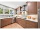 Charming kitchen featuring modern appliances, wood cabinetry, quartz countertops, and recessed lighting at 14 N Lawsona Blvd, Orlando, FL 32801
