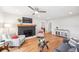 Stylish living room with a cozy fireplace, hardwood floors, and bright, neutral decor at 14 N Lawsona Blvd, Orlando, FL 32801