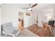 Bright office space with hardwood floors, ceiling fan, a gray chair, and doorway views to other rooms in the house at 14 N Lawsona Blvd, Orlando, FL 32801