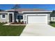 Beautiful single-story home featuring a neutral color scheme, landscaped yard, and a spacious two-car garage at 14294 Sw 33Rd Court Rd, Ocala, FL 34473