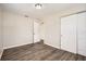 Bedroom features wood-look floors and a closet for ample storage space at 1602 Sheffield Rd, Leesburg, FL 34748