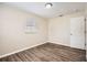 Bedroom featuring a ceiling fan, and wood-look flooring for a modern style at 1602 Sheffield Rd, Leesburg, FL 34748