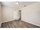 This bedroom has a closet with white doors and laminate flooring at 1602 Sheffield Rd, Leesburg, FL 34748