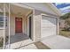 A close up of the front entry and the one car garage at 1602 Sheffield Rd, Leesburg, FL 34748