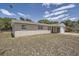 Charming single-story home with light brick facade on a sunny day at 1602 Sheffield Rd, Leesburg, FL 34748