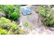 An aerial view of the property highlights the home's location amidst a lush, green landscape at 16908 Sw 44Th Cir, Ocala, FL 34473