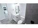 Modern bathroom featuring a single vanity and gray tiled shower and floor at 16908 Sw 44Th Cir, Ocala, FL 34473