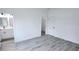 A modern bedroom leads into a bathroom and features closet space at 16908 Sw 44Th Cir, Ocala, FL 34473
