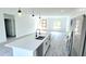 Bright, open kitchen featuring a kitchen island with a stainless steel dishwasher at 16908 Sw 44Th Cir, Ocala, FL 34473