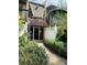 Front entrance featuring a walkway, beautiful landscaping, and natural light at 1695 Lee Rd # E214, Winter Park, FL 32789