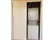 Laundry closet features a stacked washer and dryer unit with neutral walls at 1695 Lee Rd # E214, Winter Park, FL 32789