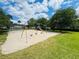 Outdoor playground featuring a dome climber, swingset, slide and green grassy lawn at 1695 Lee Rd # E214, Winter Park, FL 32789