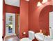 The bathroom features a sink and vanity, toilet, and a door to the backyard at 17117 Cypress Preserve Pkwy, Orlando, FL 32820