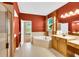 This bathroom features a tub and a window that lets in natural light at 17117 Cypress Preserve Pkwy, Orlando, FL 32820