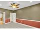 Spacious bedroom with two-tone walls, carpet flooring and interior doors at 17117 Cypress Preserve Pkwy, Orlando, FL 32820