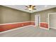 Bedroom with two-tone walls, carpet flooring, and interior doors at 17117 Cypress Preserve Pkwy, Orlando, FL 32820