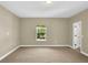 Spacious bedroom with carpet flooring, neutral walls, and a window at 17117 Cypress Preserve Pkwy, Orlando, FL 32820