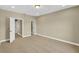 Bedroom featuring carpet flooring, neutral walls, closet, and interior doors at 17117 Cypress Preserve Pkwy, Orlando, FL 32820