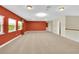 Open bonus room features neutral carpet, several windows, and lots of natural light at 17117 Cypress Preserve Pkwy, Orlando, FL 32820